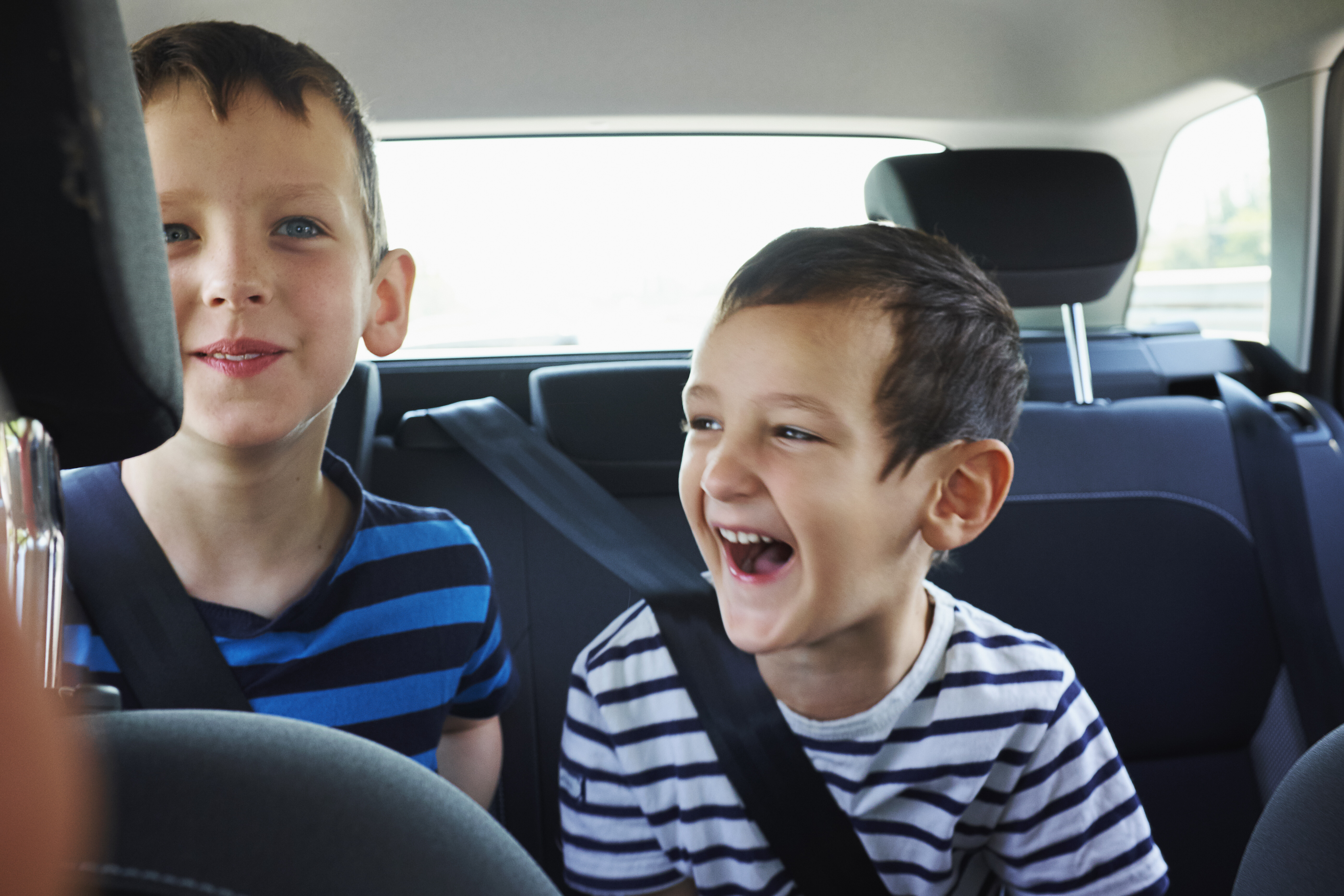 Boys in the backseat of a car