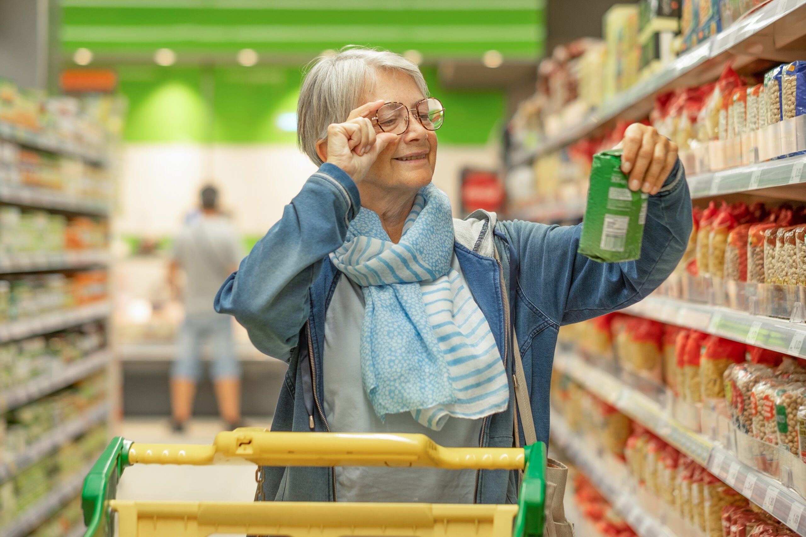 Portrait smiling senior woman making purchases in the supermarke