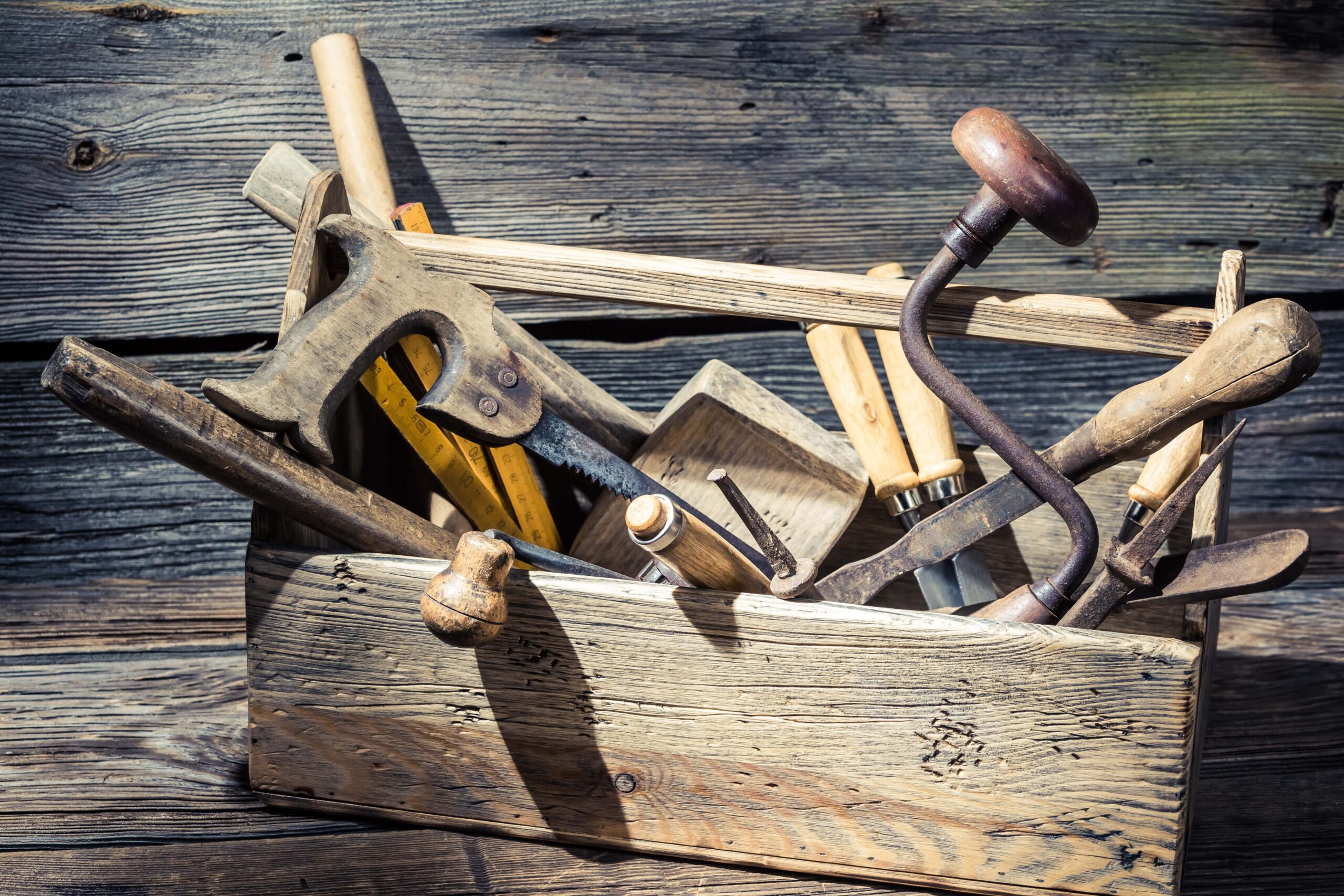 old-wooden-carpenters-box-with-tools-on-old-wooden-2023-11-27-05-36-18-utc-min